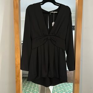 ASTR size medium long sleeve black romper with bow